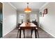 Traditional dining room with a wooden table, modern lighting, and framed artwork at 3520 Colony Rd # D, Charlotte, NC 28211