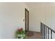 Cozy covered entrance features a patterned front door and floral decorations at 3520 Colony Rd # D, Charlotte, NC 28211