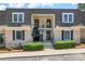 Charming townhome featuring classic brick facade, covered balconies, and well-manicured landscaping at 3520 Colony Rd # D, Charlotte, NC 28211