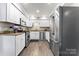 Bright kitchen with granite countertops, stainless steel appliances, and ample storage space at 3520 Colony Rd # D, Charlotte, NC 28211