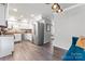 Modern kitchen featuring white cabinets, stainless steel appliances, and hardwood floors at 3520 Colony Rd # D, Charlotte, NC 28211