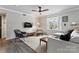 Comfortable living room with modern furniture, ample natural light, and ceiling fan at 3520 Colony Rd # D, Charlotte, NC 28211