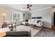 Bright living room boasts a large bay window, comfortable seating, and stylish decor at 3520 Colony Rd # D, Charlotte, NC 28211