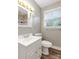 Bathroom featuring a white vanity and patterned shower at 3624 Moultrie St, Charlotte, NC 28209