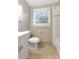 Cozy bathroom featuring a vanity, sink, toilet, and shower at 3624 Moultrie St, Charlotte, NC 28209