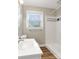 Bright bathroom with a white vanity and shower at 3624 Moultrie St, Charlotte, NC 28209