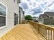 Wide angle shot of a backyard deck with wood railings, overlooking the street at 4732 Water Oak Rd, Charlotte, NC 28211