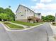 Street view of the rear of newly constructed townhomes with raised decks and garages at 4732 Water Oak Rd, Charlotte, NC 28211