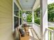 Cozy covered porch with wicker chairs and a view of the neighborhood landscape at 4732 Water Oak Rd, Charlotte, NC 28211