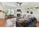 Cozy living room features a fireplace, dark hardwood floors, and natural light at 4732 Water Oak Rd, Charlotte, NC 28211