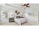 Bright, stylish main bedroom with a ceiling fan, neutral colors, and large windows at 4732 Water Oak Rd, Charlotte, NC 28211