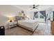 Bright main bedroom featuring a ceiling fan and three large windows at 500 Cedar Knoll Cir, Pineville, NC 28134