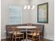 Charming dining area features a built-in bench and stylish light fixture at 500 Cedar Knoll Cir, Pineville, NC 28134
