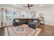 Spacious living room with hardwood floors, large sectional, and plenty of natural light at 500 Cedar Knoll Cir, Pineville, NC 28134