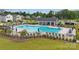 Community pool featuring ample seating and a modern clubhouse, perfect for relaxing and entertaining residents at 500 Cedar Knoll Cir, Pineville, NC 28134