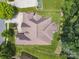 Aerial view of a stunning home with a well-maintained lawn, driveway and treed lot at 5805 Copperleaf Commons Ct, Charlotte, NC 28277
