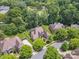 Aerial view showcasing a neighborhood with mature trees and well-kept lawns at 5805 Copperleaf Commons Ct, Charlotte, NC 28277