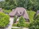Aerial view of a beautiful home with a well-manicured lawn and mature trees at 5805 Copperleaf Commons Ct, Charlotte, NC 28277