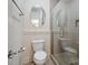 Cozy bathroom featuring a glass shower, toilet, and a decorative mirror at 5805 Copperleaf Commons Ct, Charlotte, NC 28277
