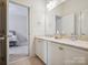 Bathroom featuring double vanity and a marble countertop at 5805 Copperleaf Commons Ct, Charlotte, NC 28277