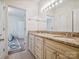Well-lit bathroom vanity with granite countertop and double sinks at 5805 Copperleaf Commons Ct, Charlotte, NC 28277