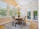 Cozy dining area with large windows providing lots of natural light at 5805 Copperleaf Commons Ct, Charlotte, NC 28277