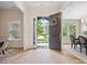 Open foyer with stone doorway view and light tile floors at 5805 Copperleaf Commons Ct, Charlotte, NC 28277