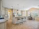 Spacious kitchen with large center island and breakfast nook at 5805 Copperleaf Commons Ct, Charlotte, NC 28277