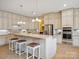 Spacious kitchen features a large island with seating, stainless steel appliances, and ample cabinetry at 5805 Copperleaf Commons Ct, Charlotte, NC 28277