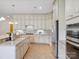Bright kitchen boasts stainless steel appliances, granite countertops, and lots of cabinet storage at 5805 Copperleaf Commons Ct, Charlotte, NC 28277