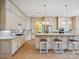 Gourmet kitchen featuring custom cabinets, granite countertops and island at 5805 Copperleaf Commons Ct, Charlotte, NC 28277