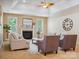 Inviting living room with fireplace, high ceilings, and lots of natural light at 5805 Copperleaf Commons Ct, Charlotte, NC 28277