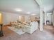 Expansive living room featuring two sofas, a coffee table, and generous natural light at 5805 Copperleaf Commons Ct, Charlotte, NC 28277