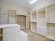 Well-organized walk-in closet with shelves, drawers, and clothing rods for efficient storage and organization at 5805 Copperleaf Commons Ct, Charlotte, NC 28277
