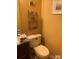 Compact bathroom with a granite vanity top, toilet, mirror and decorative wall accents at 5816 Rocky Mount Ct, Charlotte, NC 28214