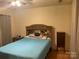 Comfortable bedroom featuring a queen bed and simple furnishings at 5816 Rocky Mount Ct, Charlotte, NC 28214