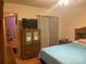 Bedroom featuring queen bed, armoire and ensuite bathroom at 5816 Rocky Mount Ct, Charlotte, NC 28214