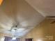 Vaulted ceiling with hanging light fixture, in room with tan walls at 5816 Rocky Mount Ct, Charlotte, NC 28214