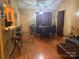 Cozy dining area featuring hardwood floors and natural light coming from the kitchen at 5816 Rocky Mount Ct, Charlotte, NC 28214