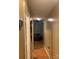Inviting hallway with wood floors and natural light leads into the living area at 5816 Rocky Mount Ct, Charlotte, NC 28214