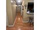 Hallway boasts hardwood floors and kitchen passthrough with breakfast bar at 5816 Rocky Mount Ct, Charlotte, NC 28214