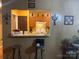 View of the kitchen through serving hatch, great spot for meals and entertaining at 5816 Rocky Mount Ct, Charlotte, NC 28214