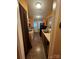 Galley kitchen with wood cabinets, laminate counters, and a view to the back door at 5816 Rocky Mount Ct, Charlotte, NC 28214