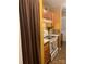 Practical kitchen features wood cabinets, white appliances, and neutral countertops at 5816 Rocky Mount Ct, Charlotte, NC 28214