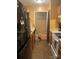 Compact kitchen with laminate flooring and updated appliances at 5816 Rocky Mount Ct, Charlotte, NC 28214