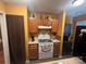 Efficient kitchen with white appliances, wood cabinets, and laminate countertops at 5816 Rocky Mount Ct, Charlotte, NC 28214