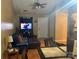 Cozy living room with comfortable seating, television, ceiling fan, and natural light at 5816 Rocky Mount Ct, Charlotte, NC 28214