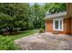 This backyard features a concrete patio and lush landscaping at 5926 Sharon Rd, Charlotte, NC 28210