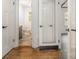 This bathroom features neutral paint, tile flooring, and a white toilet and sink at 5926 Sharon Rd, Charlotte, NC 28210