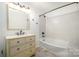 Bathroom features a vanity with sink, tiled shower and tub at 5926 Sharon Rd, Charlotte, NC 28210